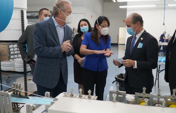 U.S. Department of Energy Deputy Secretary Mark Menezes (right) tours the DemeTECH N95 filter material production area with Xin Sun, ORNL interim associate laboratory director (center) and Craig Blue, ORNL advanced manufacturing program manager. Credit: US Dept. of Energy