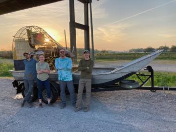 The research team poses in front of the airboat after a long day of research. Credit: ORNL, U.S. Dept. of Energy