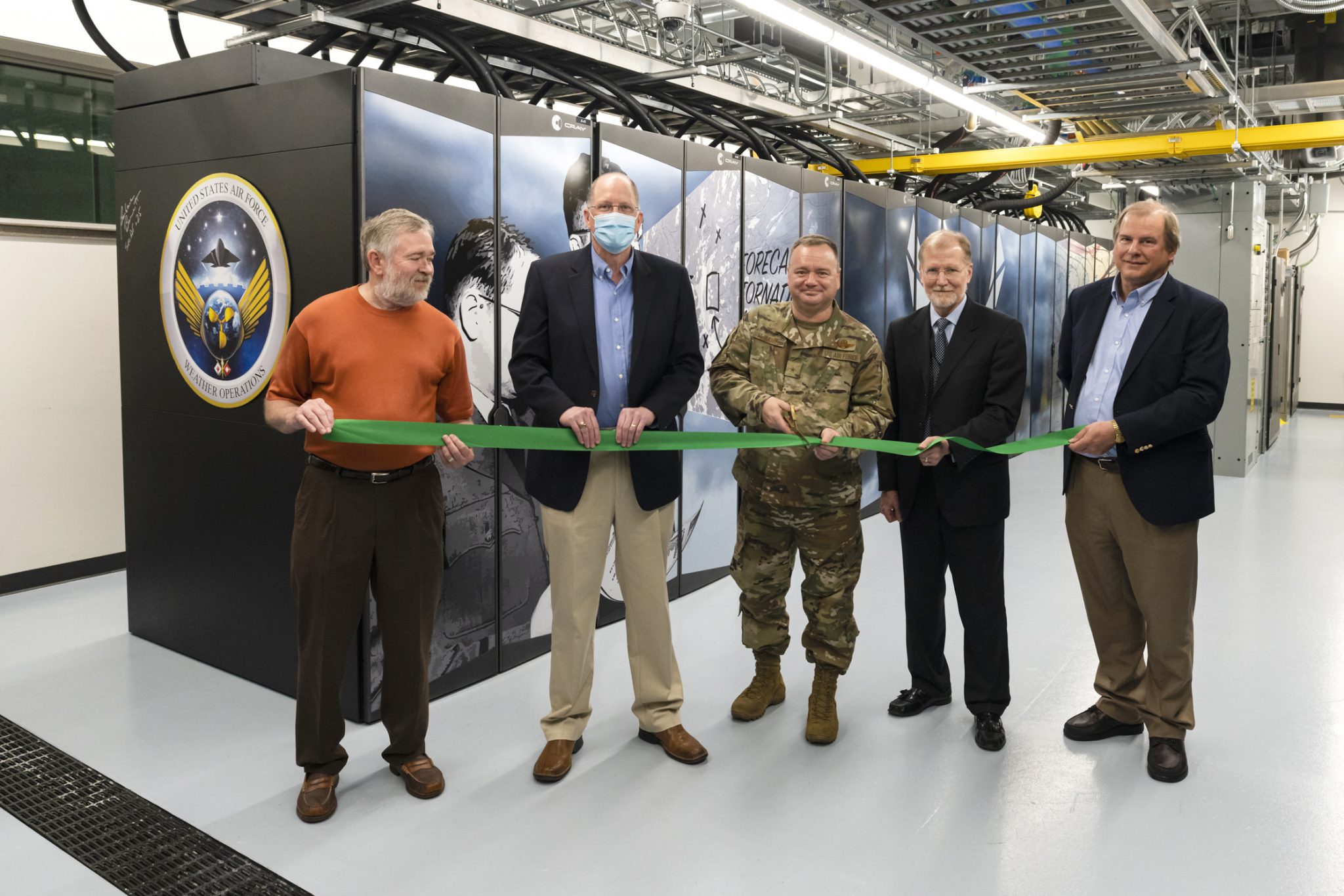 Five men from ORNL and the AF stand in front of the weather computing system. 