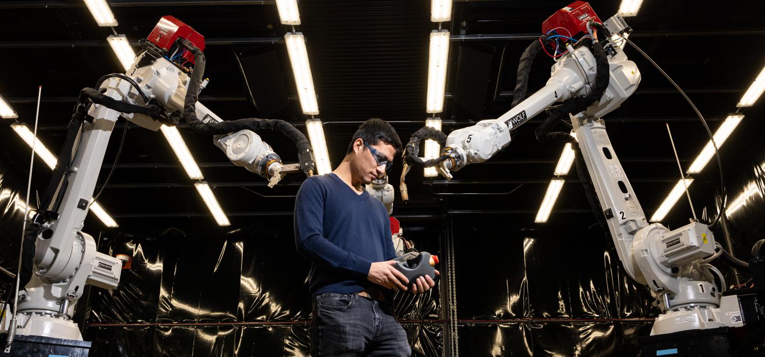 Peter Wang with MedUSA at MDF, Manufacturing Demonstration Facility, December 13, 2019. MedUSA - the large-scale hybrid system is an additive, subtractive and machining system with three robotic arms. 