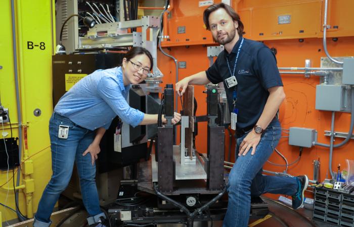 Professors Zhenzhen Yu (left) and Michael Joachim Andreassen use neutrons at HFIR’s NRSF2 to investigate residual stresses expected to occur in the welds of offshore underwater wind turbine foundations. (Credit: ORNL/Genevieve Martin)
