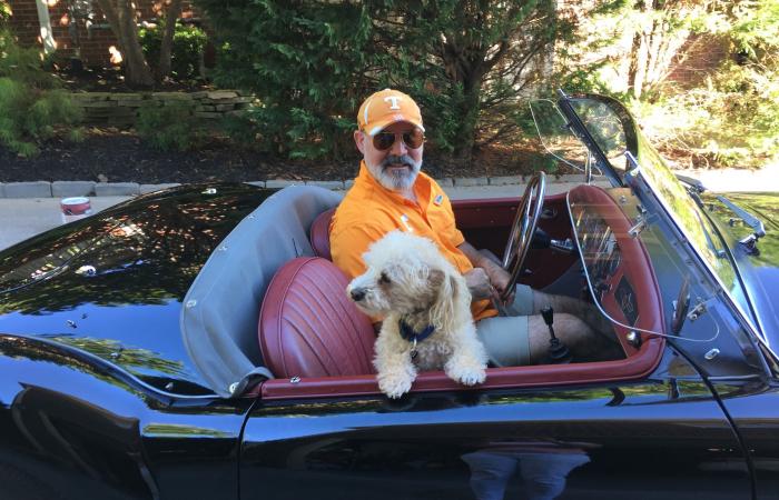 Tom Kollie with dog and project car