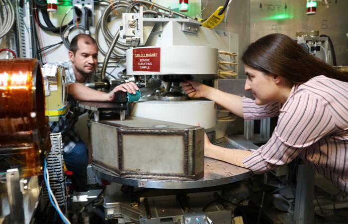 From left, ORNL’s Matthew Frost and Leah Broussard used a neutron scattering instrument at the Spallation Neutron Source to search for a dark matter twin to the neutron. Credit: Genevieve Martin/ORNL, U.S. Dept. of Energy
