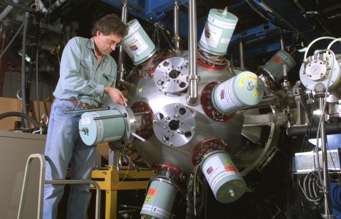 Work at the Holifield Radioactive Ion Beam Facility by physicists like David Radford, shown adjusting a gamma-ray detector in 1998, lives on in the Facility for Rare Isotope Beams. Credit: Curtis Boles/ORNL, U.S. Dept. of Energy