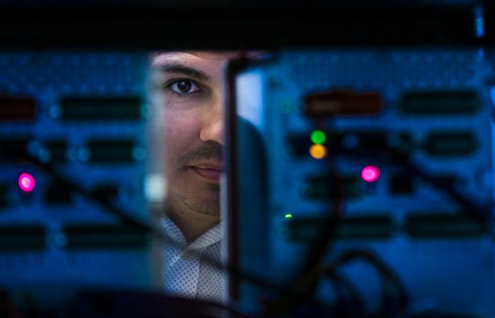 A team led by Raymond Borges Hink has developed a method using blockchain to protect communications between electronic devices in the electric grid, preventing cyberattacks and cascading blackouts. Credit: Genevieve Martin/ORNL, U.S. Dept. of Energy
