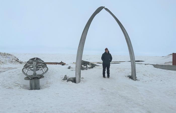 Colleen Iversen under the whalebone arch known as the “Gateway to the Arctic” in the town of Utqiaġvik, Alaska. Credit: ORNL/U.S. Dept. of Energy