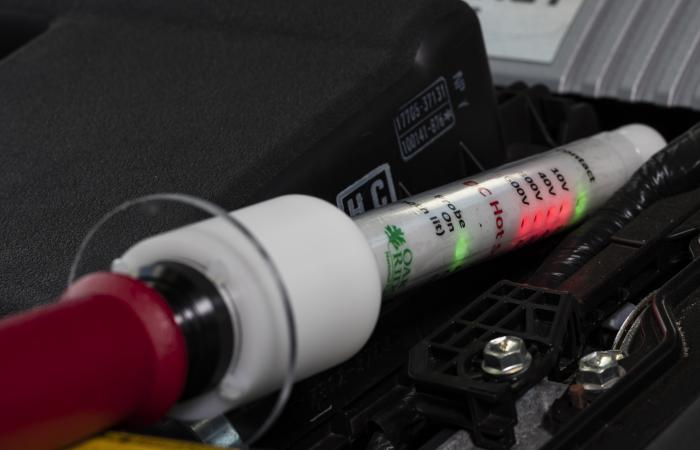 The DC hotstick voltage probe can accurately detect the presence of DC voltages in a hybrid electric vehicle. Credit: Carlos Jones/Oak Ridge National Laboratory, U.S. Dept. of Energy.
