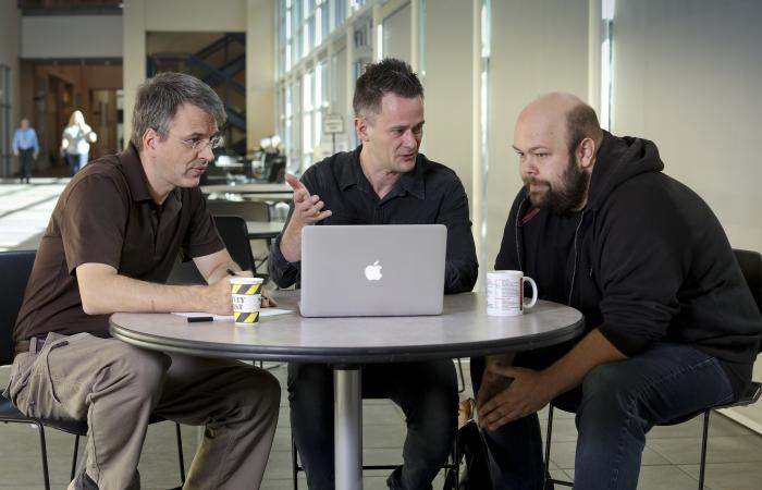 From left, Center for Accelerated Application Readiness researchers Thomas Papenbrock, Gaute Hagen and Gustav Jansen discuss improving codes that must run on increasingly more powerful supercomputers.