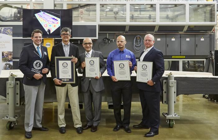 GUINNESS WORLD RECORDS judge Michael Empric awarded the title of Largest solid 3D printed item to ORNL Laboratory Director Thom Mason, Leo Christodoulou from The Boeing Company, ORNL’s Vlastimil Kunc and Mike Matlack from Boeing.
