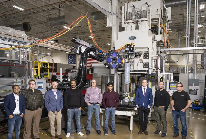 Researchers pictured here at the DOE Manufacturing Demonstration Facility at ORNL developed the R&D 100 Award-winning hybrid additive manufacturing-compression molding, or AM-CM, technology. Credit: ORNL, U.S Dept. of Energy