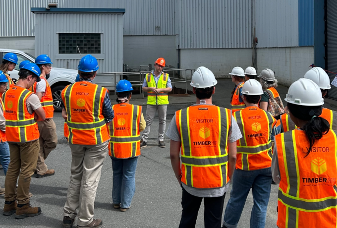 Group of people in safety vests and hard hats