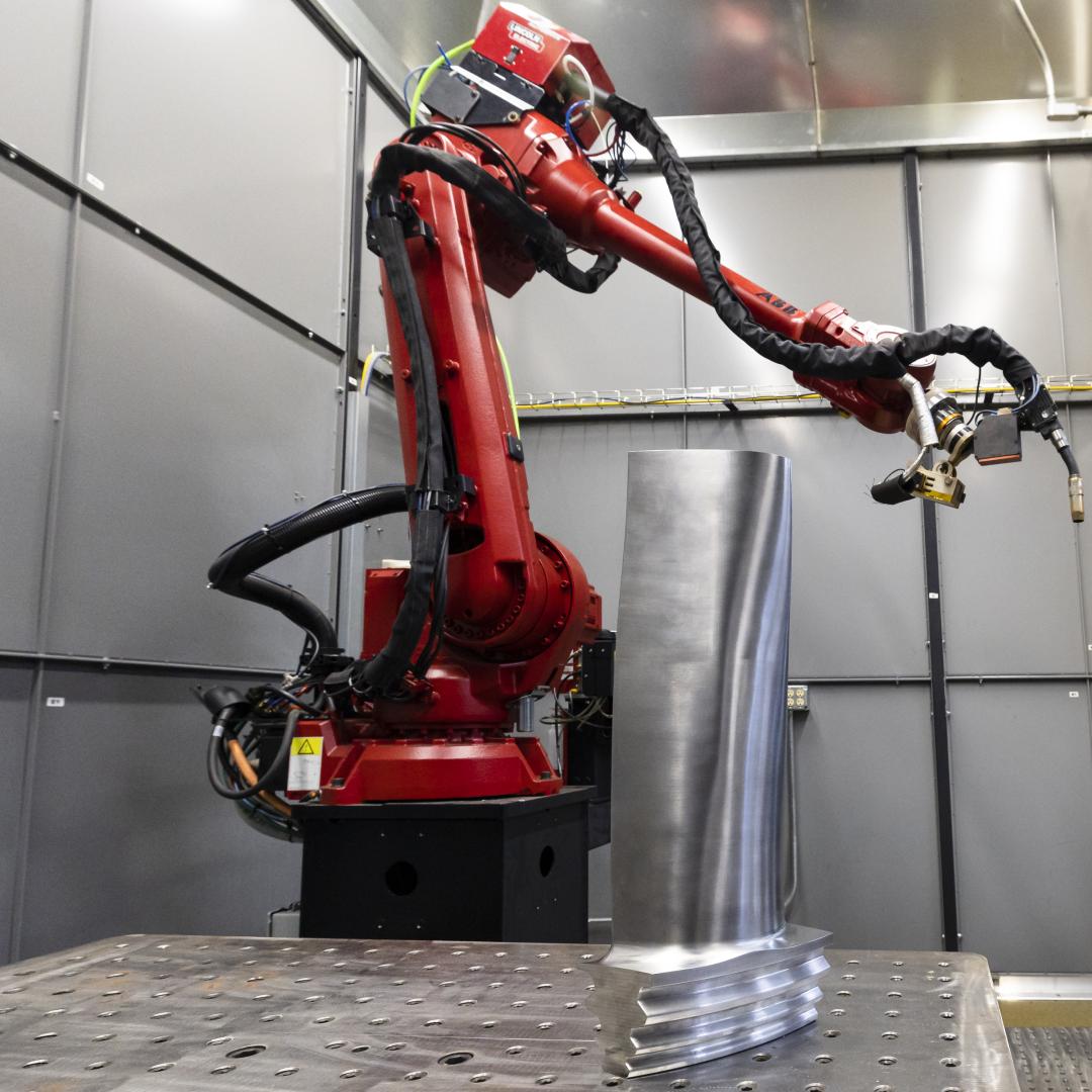 Wire arc additive manufacturing allowed this robot arm at ORNL to transform metal wire into a complete steam turbine blade like those used in power plants. Credit: Carlos Jones/ORNL, U.S. Dept. of Energy