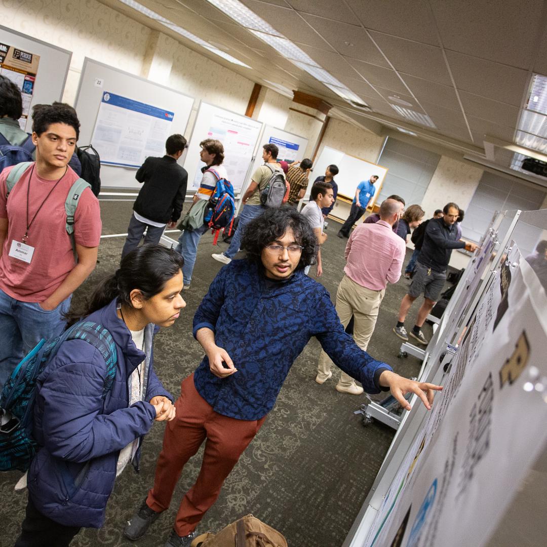 Students gather at a poster session