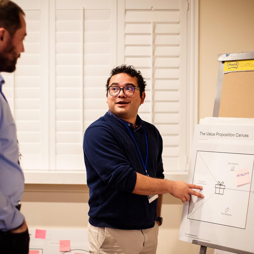 Dmytro Bykov, left, and Hector Corzo participate in a value proposition development exercise as part Energy I-Corps