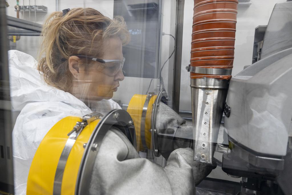 ORNL technician Patty Tedder performs work in a hot cell