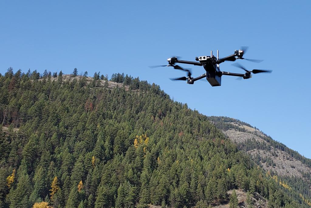 Drone flying near mountain
