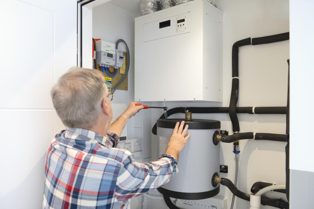 Hot water heater installation. Credit: Getty Images