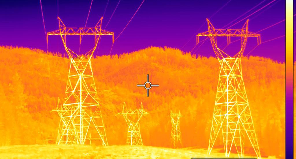 Heat image of power lines with transformer towers
