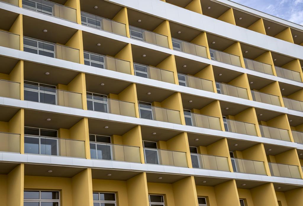 Side of building showing windows and balconies.