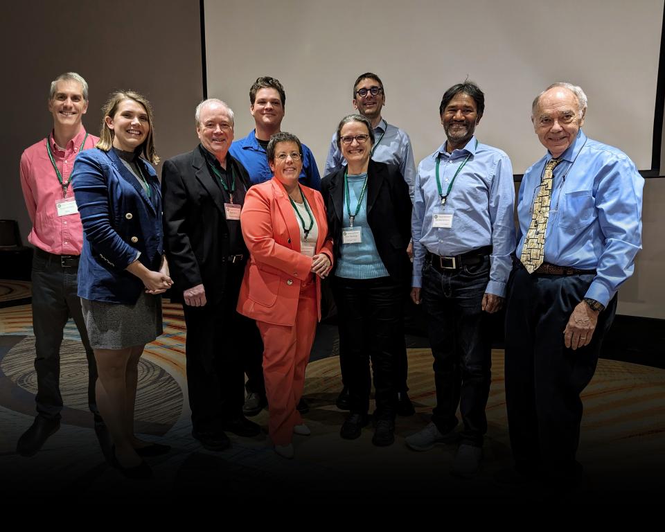 Symposium chair Lætitia Delmau, center, stands with members of the program committee.