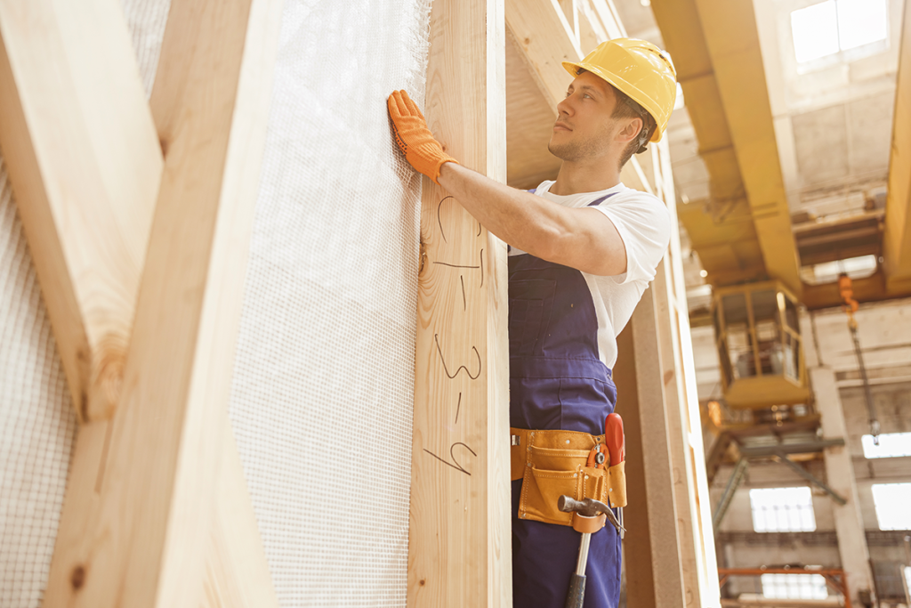 Builder constructing walls