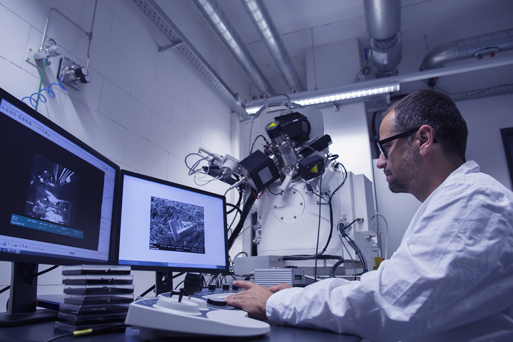 Lab researcher working with SEM images