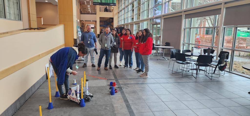 Members of the Tennessine Titans demonstrate their robot on ORNL's campus. Credit: Carlos Jones. 