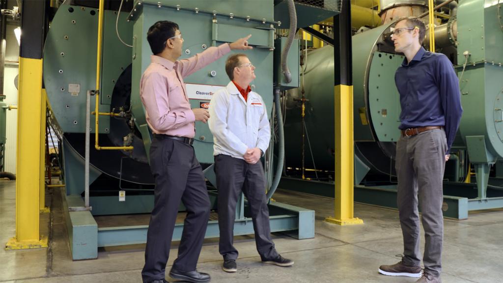 ORNL's Sachin Nimbalkar, left, visits Better Plants Climate Challenge partner Nissan North America Inc., to talk about how switching boilers to natural gas has led to significant improvements in energy efficiency and carbon reduction for the automobile manufacturer. Credit: ORNL, U.S. Dept. of Energy