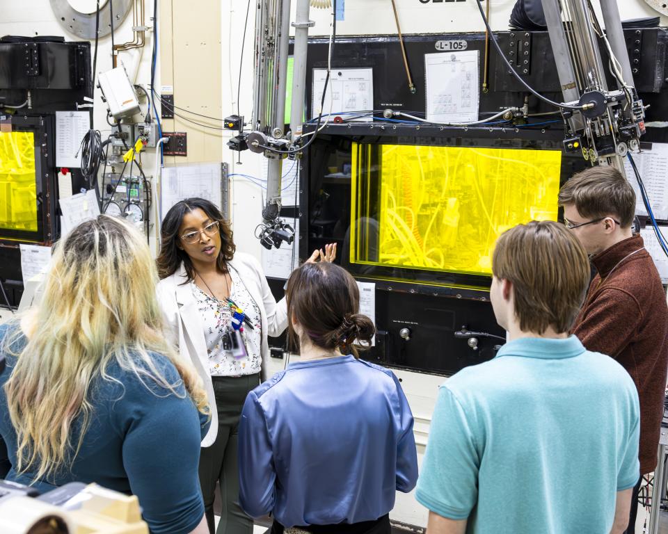 Clarice Phelps, second from left, shows a hot cell in the Radiochemical Engineering Development Center to Pellissippi students Taylor Lundquist, Haley Massey, Jared Dowell and Hayden Presley. Phelps has taught the students in radiochemistry through Pellissippi State and ORNL’s joint Chemical Radiation Technology Pathway. Credit: Carlos Jones/ORNL, U.S. Dept. of Energy