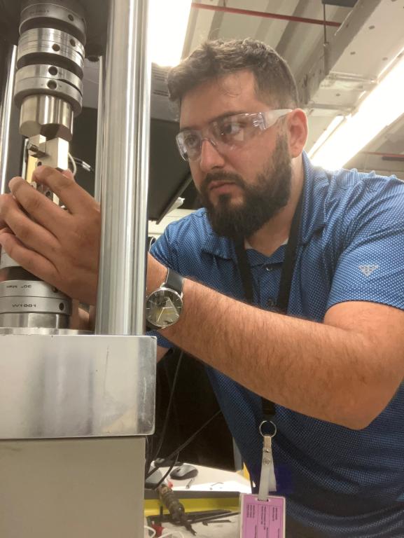 A technician in the Advanced Nuclear Materials Group works in the lab.