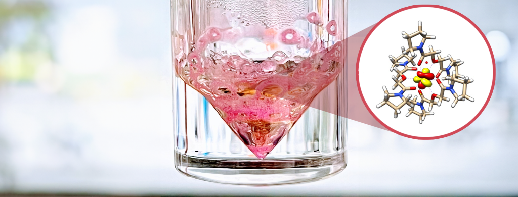 Pink diamond shape in a glass jar. There is a cut out showing the chemical makeup of what's inside. 