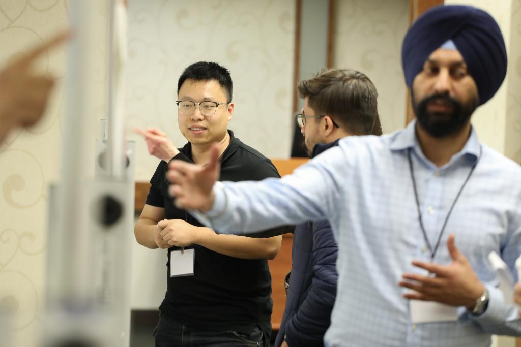 At the summer school’s poster session, early-career scientists presented their QSC-supported research results. Credit: Dave Mason/Purdue University