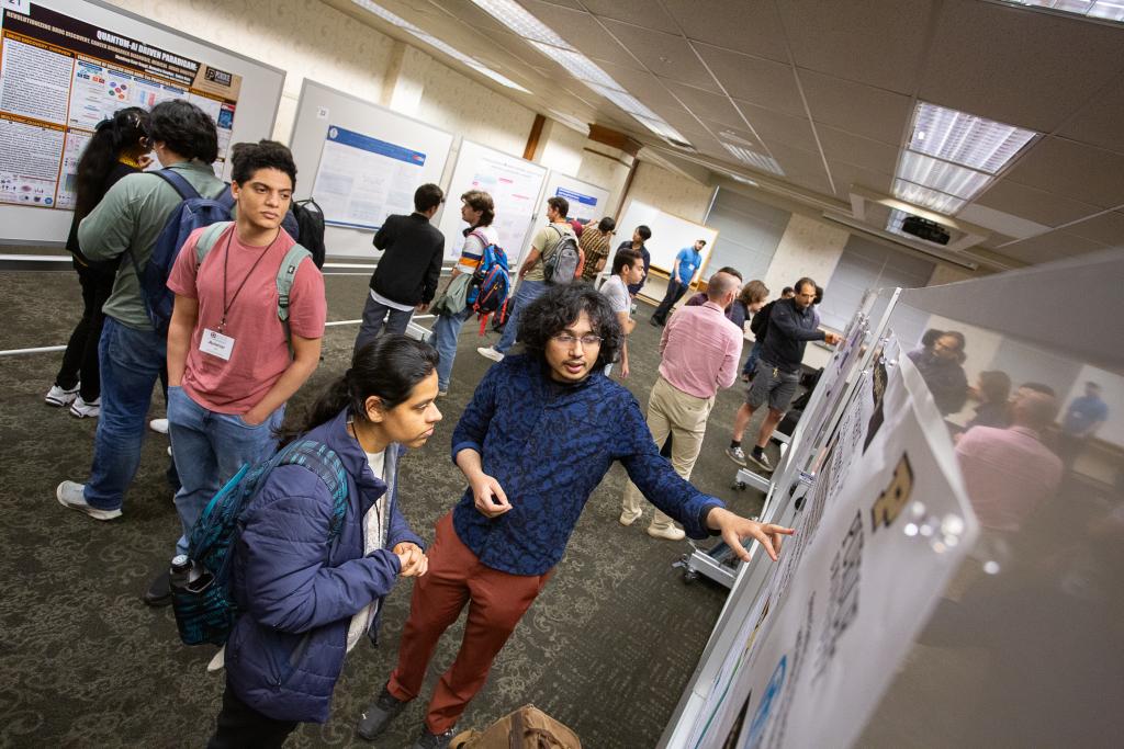 Students gather at a poster session