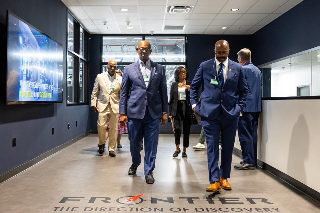 During an event to celebrate a commercial license to U2opia Technology, ORNL Partnerships Director Mike Paulus, far right, leads a tour of Frontier, the world’s fastest supercomputer, which is located at ORNL. From left to right are Maurice Foxworth, Harry Staley, Joaneane Smith, Maurice Singleton and Paulus. Credit: Carlos Jones/ORNL, U.S. Dept. of Energy