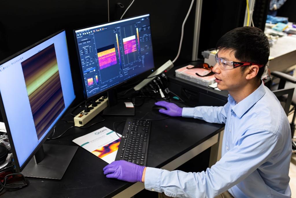 Eugene P. Wigner Fellow Huan Zhao working in his lab