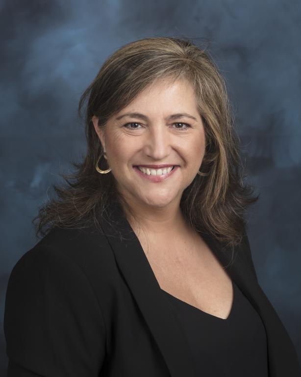 Neus Domingo Marimon, ORNL scientist, poses for a photo in black with hair down