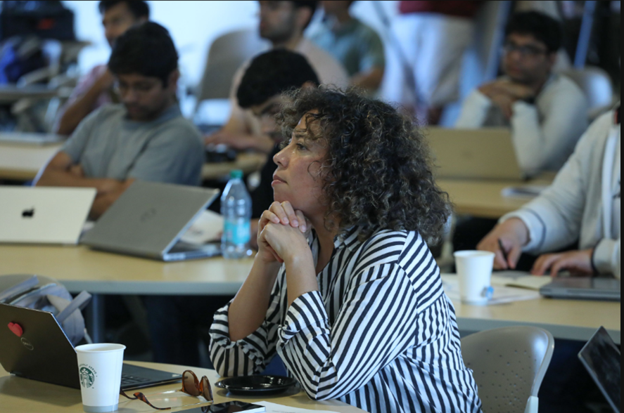 Quantum Science Center Summer School attendee is watching a presentation during one of the sessions.