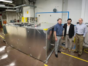 From left, David Dean, Alfredo Galindo-Uribarri and Chris Bryan of Oak Ridge National Laboratory check on a prototype detector at the High Flux Isotope Reactor, a Department of Energy Office of Science User Facility that creates continuous neutron beams. From left, David Dean, Alfredo Galindo-Uribarri and Chris Bryan of Oak Ridge National Laboratory check on a prototype detector at the High Flux Isotope Reactor, a Department of Energy Office of Science User Facility that creates continuous neutron beams.