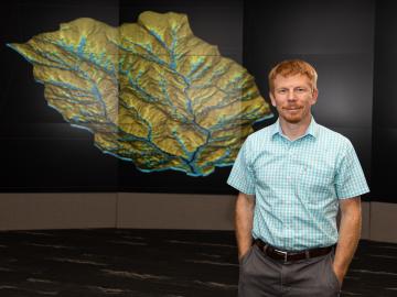 Ethan Coon uses math and computational science to model the flow of above and belowground water in watersheds.