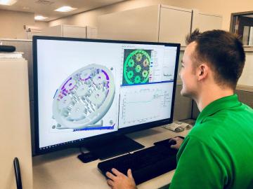 Researcher Chase Joslin uses Peregrine software to monitor and analyze a component being 3D printed at the Manufacturing Demonstration Facility at ORNL. Credit: Luke Scime/ORNL, U.S. Dept. of Energy.
