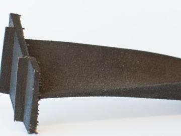 A 3D printed turbine blade demonstrates the use of the new class of nickel-based superalloys that can withstand extreme heat environments without cracking or losing strength. Credit: ORNL/U.S. Dept. of Energy