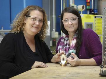 ORNL’s Bianca Haberl and Amy Elliott hold 3D-printed collimators — an invention that has been licensed to ExOne, a leading binder jet 3D printer company. Credit: Genevieve Martin/Oak Ridge National Laboratory, U.S. Dept. of Energy