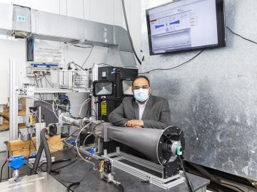 Kashif Nawaz, researcher and group leader for multifunctional equipment integration in buildings technologies, is developing a platform for the direct air capture of carbon dioxide that can be retrofitted to existing rooftop heating, ventilation and air conditioning units. Credit: ORNL/U.S. Dept. of Energy