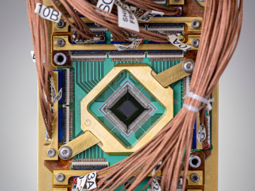 The team embedded a programmable model into a D-Wave quantum computer chip. Credit: D-Wave CSED Computational Sciences and Engineering Division ORNL