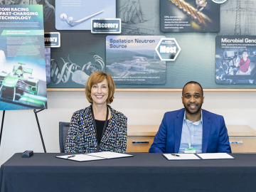 Susan Hubbard, ORNL’s deputy for science and technology, and Ricardo Marc-Antoni Duncanson, founder of Marc-Antoni Racing, celebrated the company's licensing of ORNL-developed technologies during an event on Oct. 17. Credit: Carlos Jones/ORNL, U.S. Dept. of Energy