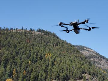Drone flying near mountain