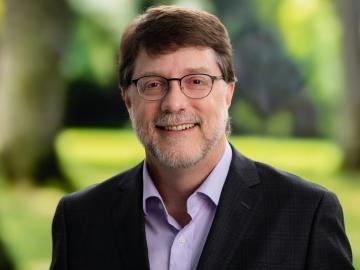 Stephen K. Streiffer named director of Oak Ridge National Laboratory. Headshot of Streiffer outside with background of green grass and trees