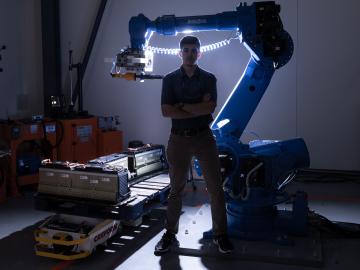 Jonathan Harter, a technical professional in ORNL’s Engineering Science and Technology Directorate, uses a robot and other automated methods to disassemble electric vehicle batteries for recycling or reuse in the electric grid. Credit: Carlos Jones/ORNL, U.S. Dept. of Energy