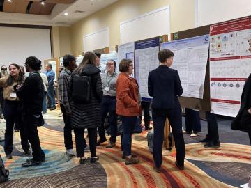 Symposium guests view posters in the poster competition. Credit: Laetitia Delmau/ORNL, U.S. Dept. of Energy