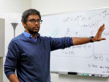 ORNL’s Suhas Sreehari explains the algebraic and topological foundations of representation systems, used in generative AI technology such as large language models. Credit: Lena Shoemaker/ORNL, U.S. Dept. of Energy